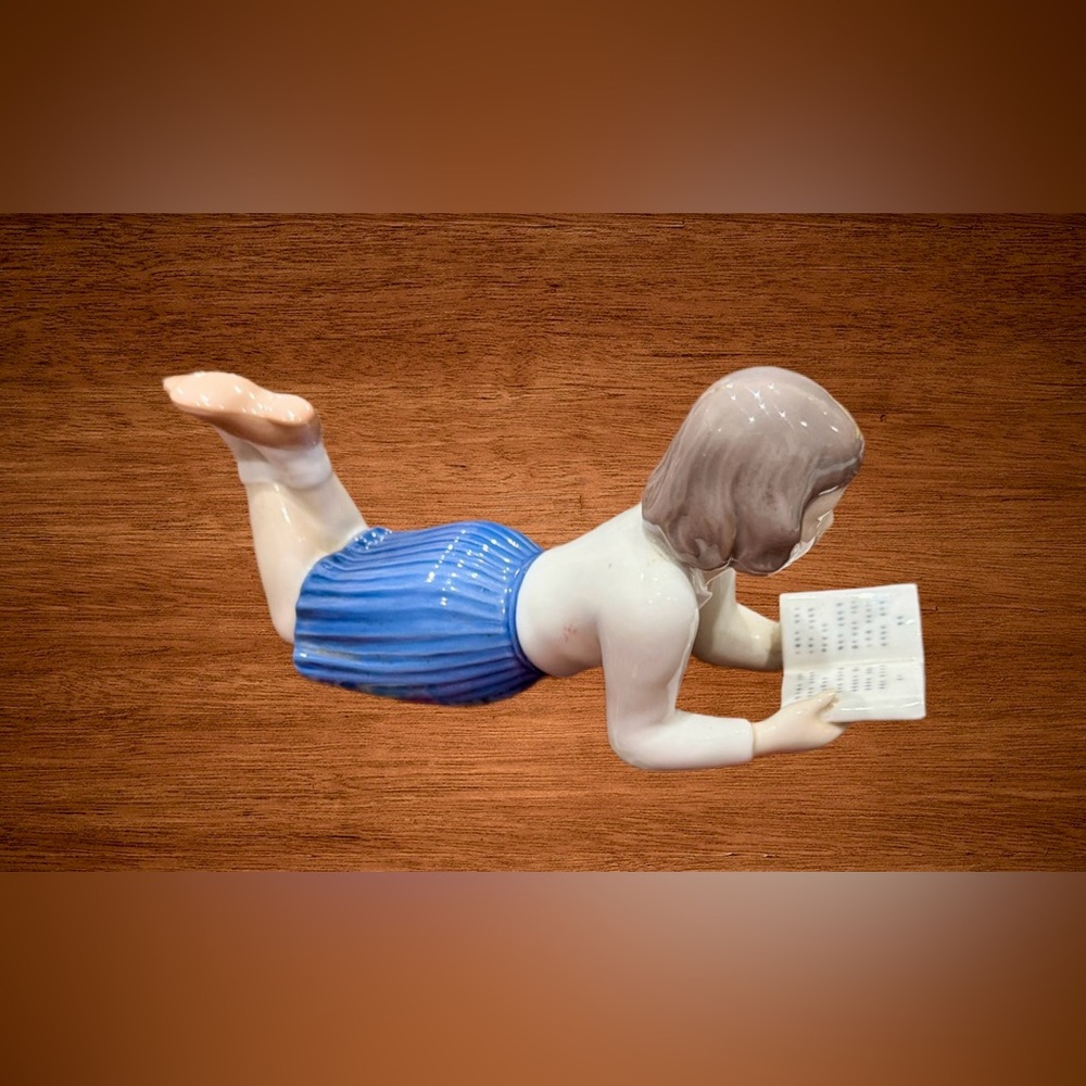 BING & GRONDAHL  PORCELAIN FIGURE. “ GIRL READING BOOK”